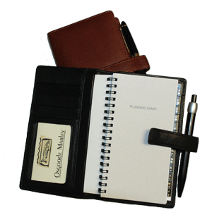 inside and outside views of black and British tan leather pocket planner systems